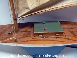 Two vintage wooden sail boats, unmarked, cloth sails and rigging deteriorating