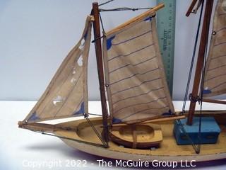 Two vintage wooden sail boats, unmarked, cloth sails and rigging deteriorating