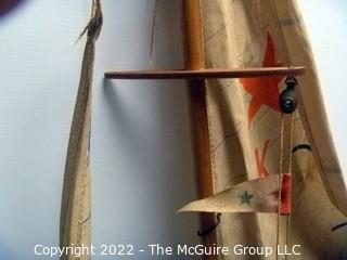 Two vintage wooden sail boats, unmarked, cloth sails and rigging deteriorating