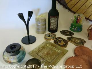 Collection including leather coasters, candles, snow globe, and a large parasol