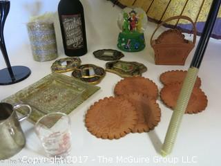 Collection including leather coasters, candles, snow globe, and a large parasol