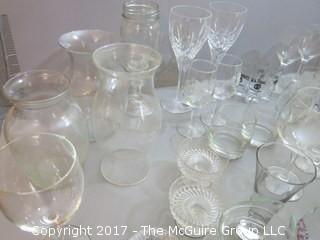 Collection of glassware including (2) Waterford crystal stems, hurricane shade and assorted stemware 