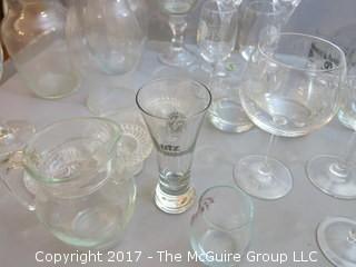 Collection of glassware including (2) Waterford crystal stems, hurricane shade and assorted stemware 