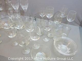 Collection of glassware including (2) Waterford crystal stems, hurricane shade and assorted stemware 