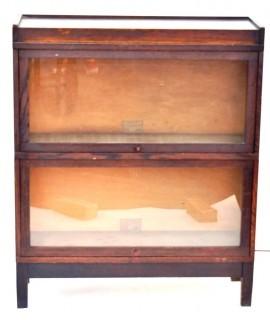 Two-section Globe Wernicke Two-Stack Glass Front Barrister Bookcase with top and base. Separates into two stackable units. 11" x 34" x 41".