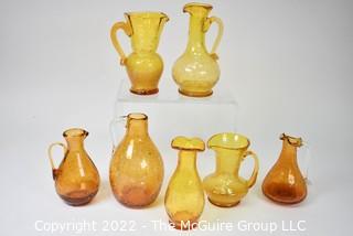 Seven (7) Pieces of Amber Pitchers and Glassware.