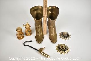 Selection of brass-like metal items: boot vases, salt & pepper, escutcheons, duck head hanger