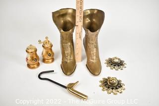 Selection of brass-like metal items: boot vases, salt & pepper, escutcheons, duck head hanger