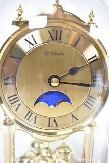 Pair of table display items: clock under glass dome and Barometer/Humidity gauges in a globe