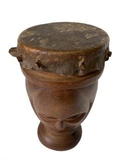 Primitive Hide and Carved Wood Figural Two Face Drum.