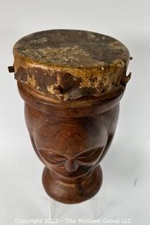 Primitive Hide and Carved Wood Figural Two Face Drum.