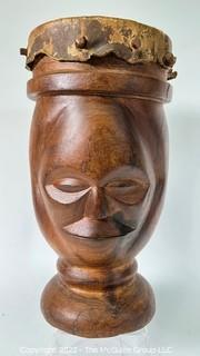 Primitive Hide and Carved Wood Figural Two Face Drum.