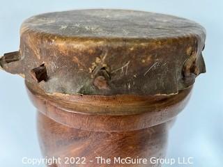 Primitive Hide and Carved Wood Figural Two Face Drum.