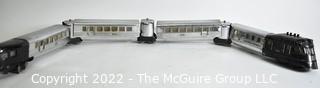 Four (4) Pieces Lionel "O" Gauge 616 Flying Yankee Passenger Train Set in Chrome and Black.616- 617- 617- 618
