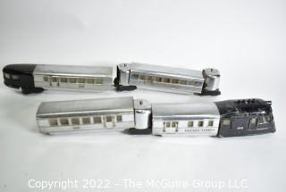 Four (4) Pieces Lionel "O" Gauge 616 Flying Yankee Passenger Train Set in Chrome and Black.616- 617- 617- 618
