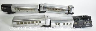 Four (4) Pieces Lionel "O" Gauge 616 Flying Yankee Passenger Train Set in Chrome and Black.616- 617- 617- 618
