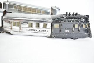 Four (4) Pieces Lionel "O" Gauge 616 Flying Yankee Passenger Train Set in Chrome and Black.616- 617- 617- 618
