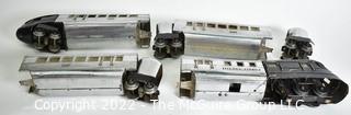 Four (4) Pieces Lionel "O" Gauge 616 Flying Yankee Passenger Train Set in Chrome and Black.616- 617- 617- 618
