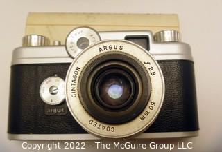 Argus C44 C Forty Four 35mm Rangefinder Camera W/ 50mm f/2.8 Lens in leather case and includes flash attachment w/bulbs