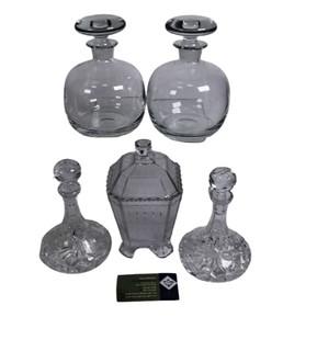 Four (4) Heavy Crystal Decanters and Lidded Jar. 