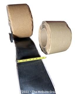 Three open rolls of adhesive and flashing. 7"W
