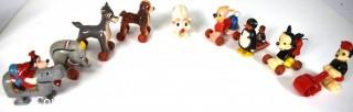 Group of Vintage Celluloid Walt Disney Productions "Fun On Wheels" Character Toys.  Each measure approximately 3" x 2 1/2"