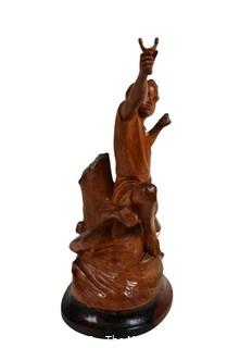 Carved Wood Sculture of Boy with a Slingshot, Signed by Artist E.S. Dans, 1975.  12" tall.