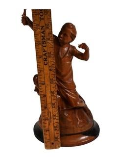 Carved Wood Sculture of Boy with a Slingshot, Signed by Artist E.S. Dans, 1975.  12" tall.