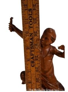 Carved Wood Sculture of Boy with a Slingshot, Signed by Artist E.S. Dans, 1975.  12" tall.