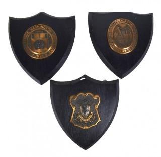 Three (3) Wood and Brass Wall Plaques including George Washington University and Dartmouth College.