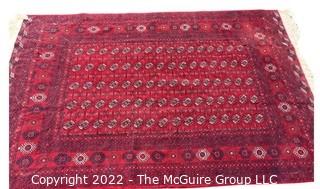 76 x 112" Turkmen Hand Knotted Rug from Afghanistan with Geometric Pattern on Red Ground.  Some moth ball odor.  