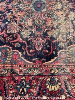 Hand Knotted Persian Rug with Repeating Pattern on Blue and Red Ground. Wear throughout. 56 x 87" 