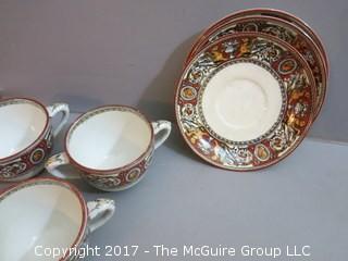 Eclectic collection of porcelain and ceramic serving ware including Limoges, Wedgwood and Spode  