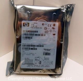 Selection of seven (7) NOS 300GB HP 3.5 hard drives