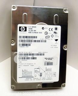 Selection of seven (7) NOS 300GB HP 3.5 hard drives