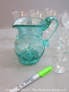 Collection including 2 etched glass serving bowls, a hand blown glass pitcher and splatter glass vase