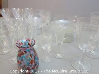 Collection including 2 etched glass serving bowls, a hand blown glass pitcher and splatter glass vase