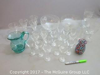 Collection including 2 etched glass serving bowls, a hand blown glass pitcher and splatter glass vase