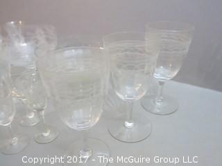 Collection including 2 etched glass serving bowls, a hand blown glass pitcher and splatter glass vase