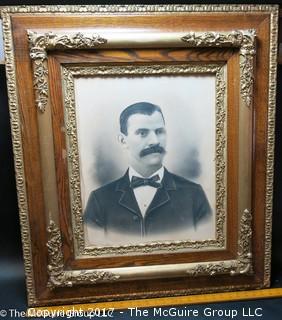 Framed black and white male portrait studio photo mounted in antique wood frame 