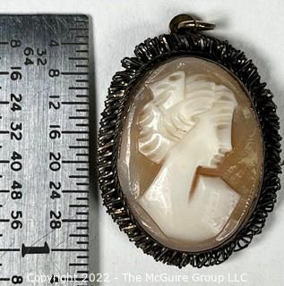 19th Century Hand Carved Cameo Set in Gold Filled Bezel Marked BA800. Measures 1" long.