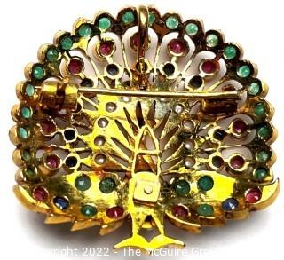 14kt Yellow Gold Peacock Brooch Pendant with Rubies, Emeralds, Sapphires and Pearls. It is unmarked, but tests as 14kt.