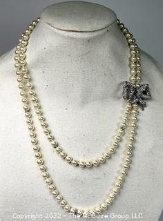 Double Strand Opera Length Faux Pearl with Rhinestone Bow Necklace. 