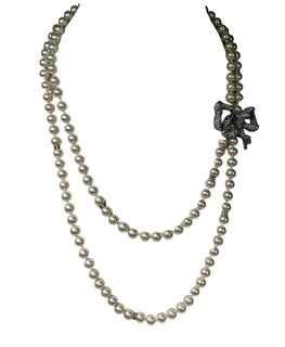 Double Strand Opera Length Faux Pearl with Rhinestone Bow Necklace. 