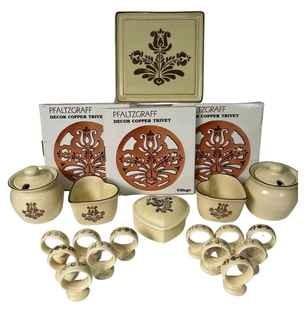 Group of Vintage Pfaltzgraff Village Table Ware Items Including Trivet (New in Box), Sugar or Jam Jar, Napkin Rings, and Hear Jars. 