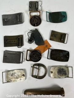 Twelve (12) Belt Buckles, Zippo Lighter, Rail Road Tie and Watch