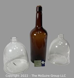 One Gallon Brown Long Neck Bottle and two Clear Glass Funnels 