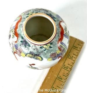 Chinese Hand Painted on White Ground Round Porcelain Vase. Measures 4" tall.