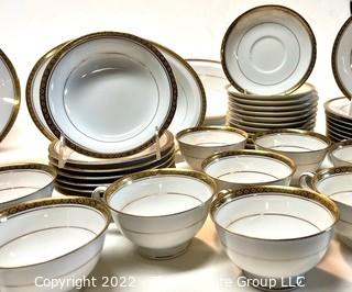 Set of Noritake Porcelain China Dinnerware in Richmond Pattern and Gold Edge.