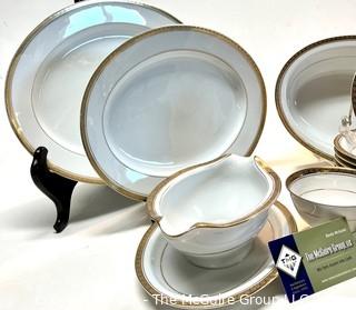 Set of Noritake Porcelain China Dinnerware in Richmond Pattern and Gold Edge.